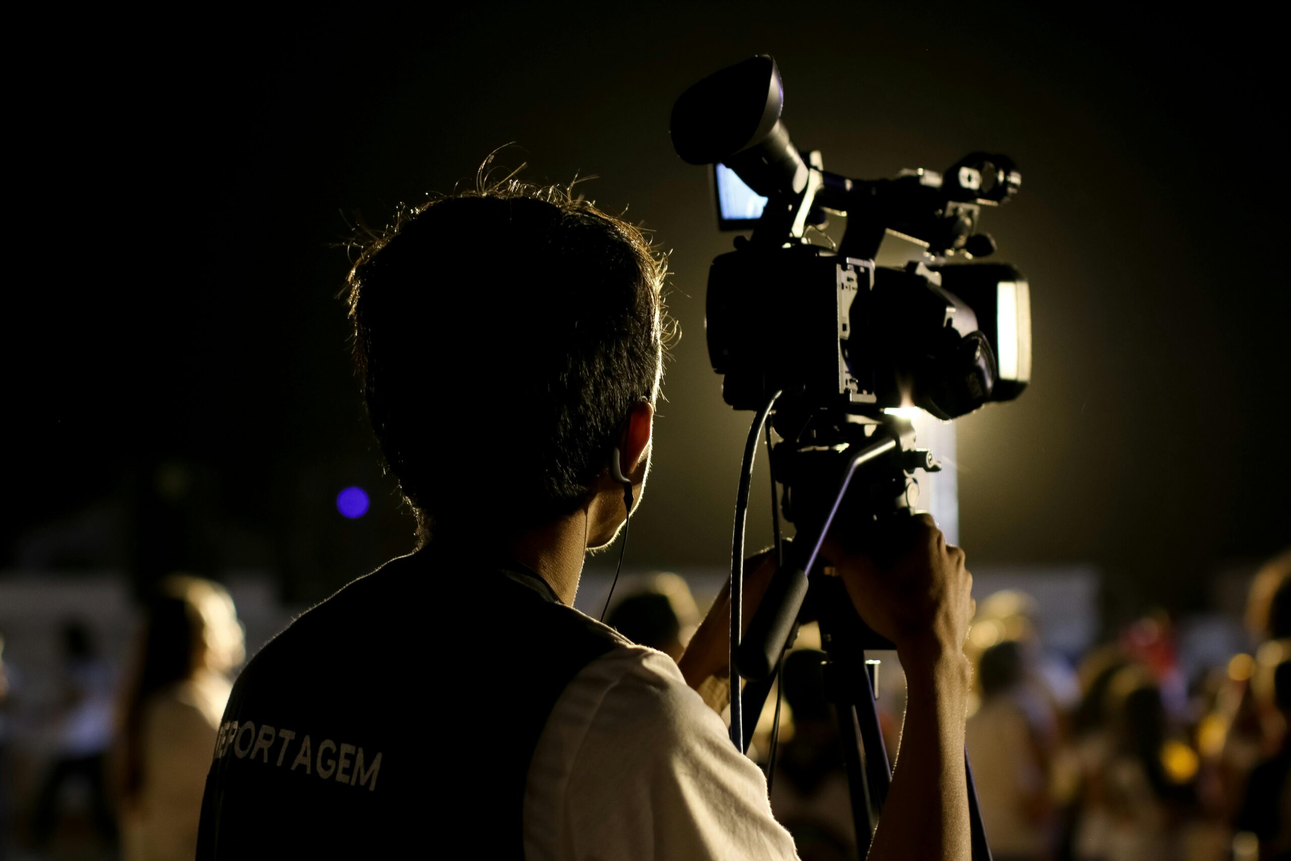 Videographer filming with a professional camera
